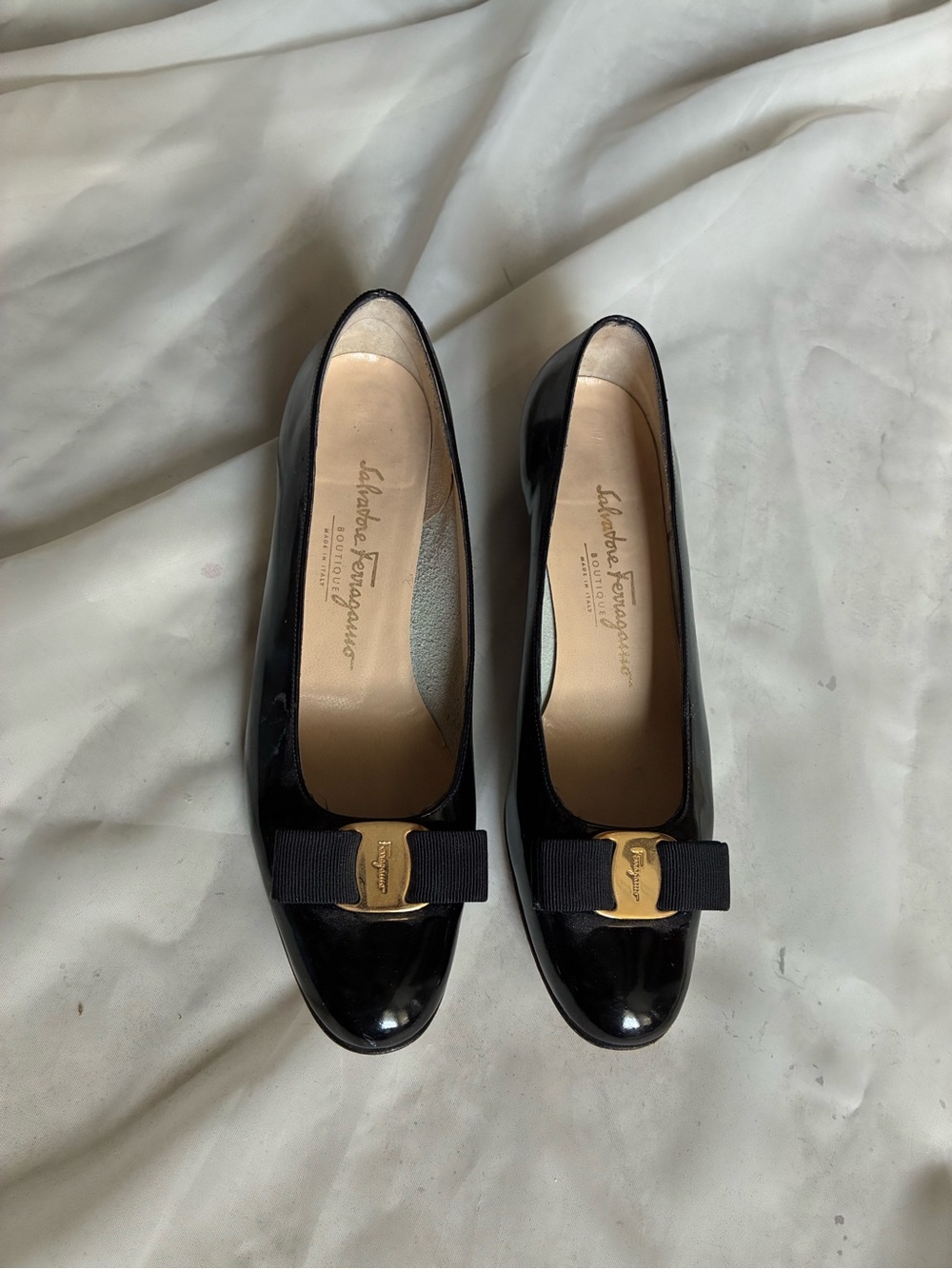 Salvatore Ferragamo Black Patent Leather Pumps with Bow and Gold Plaque